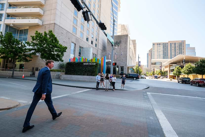 Victory Park president and owner Lothar Estein crosses Olive Street as he walks along...