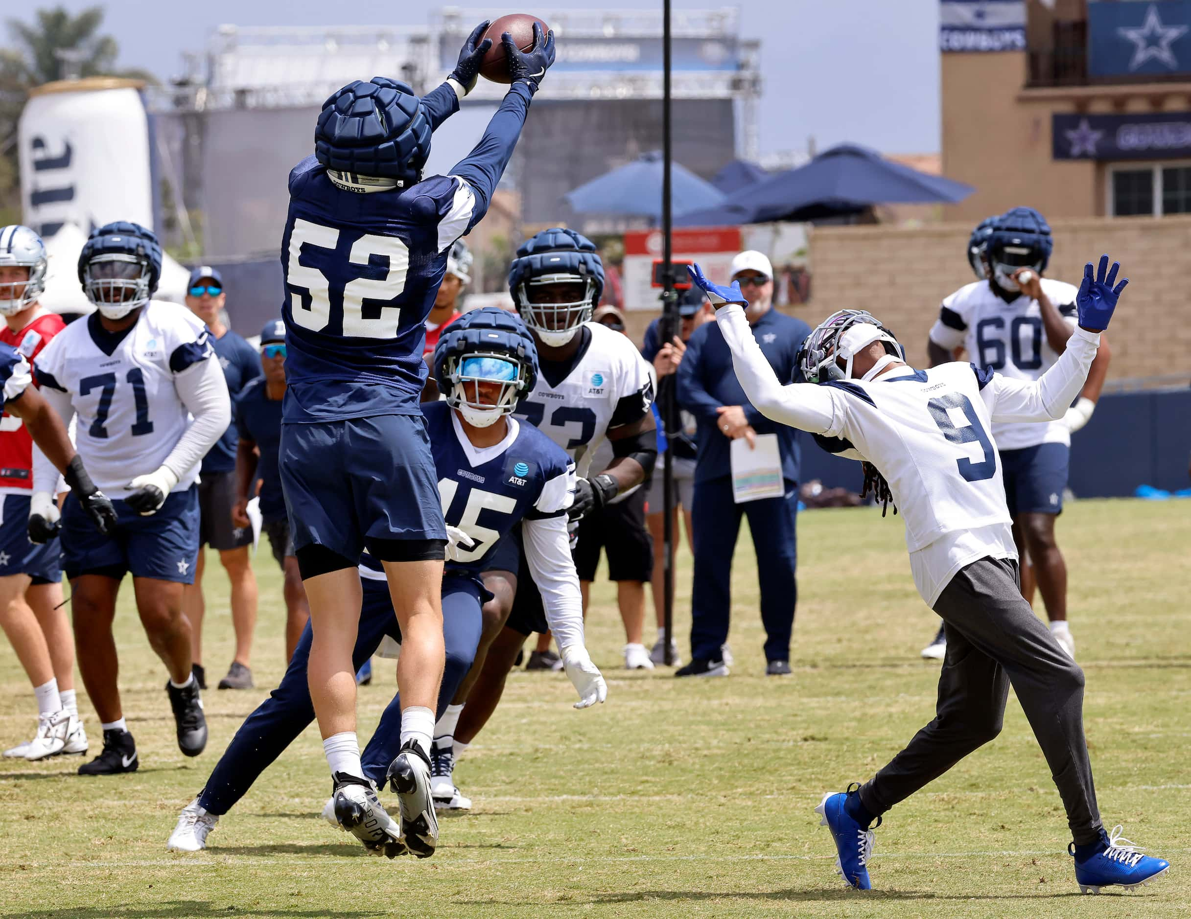 Dallas Cowboys linebacker Byron Vaughns (52) pulls down an interception on a pass thrown to...