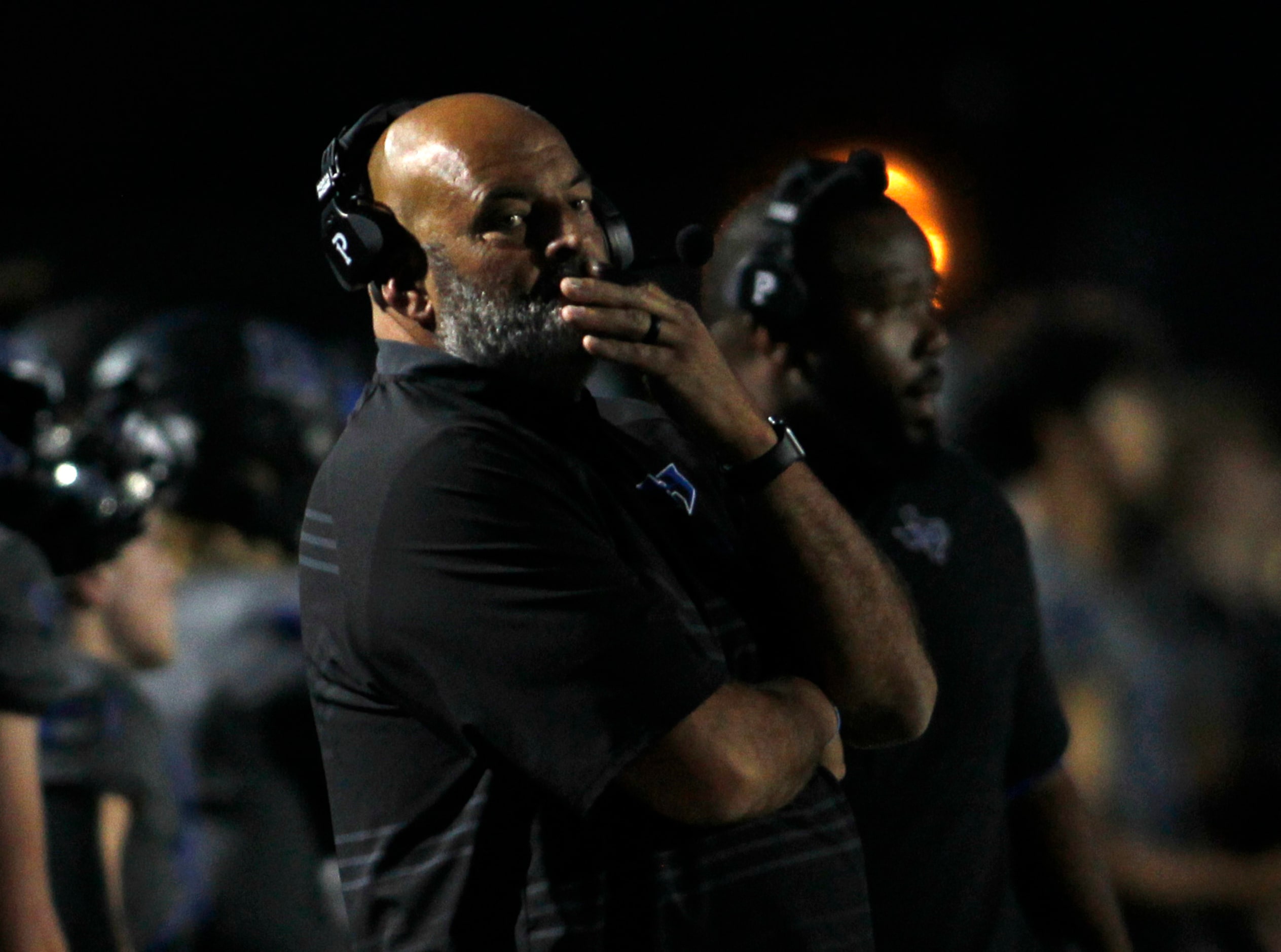 Hebron head coach Brian Brazil glances to the scoreboard during first quarter action against...