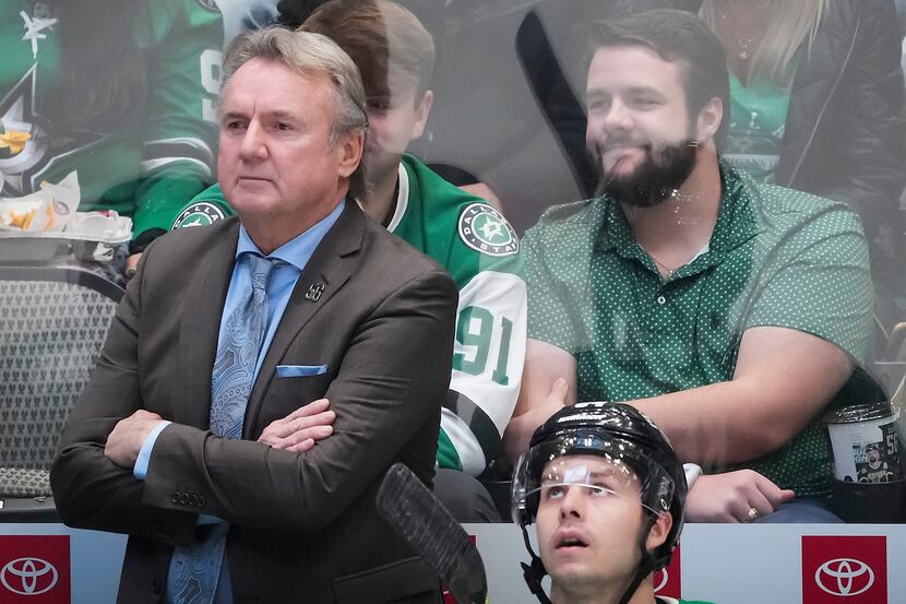 Dallas Stars coach Rick Bowness watches from the bench during the first period of an NHL...