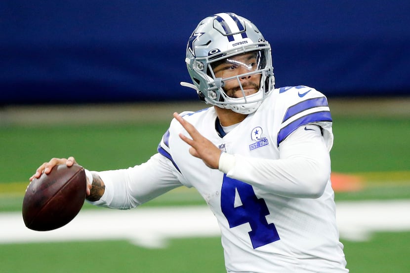 Dallas Cowboys quarterback Dak Prescott (4) throws a fourth quarter pass against the...