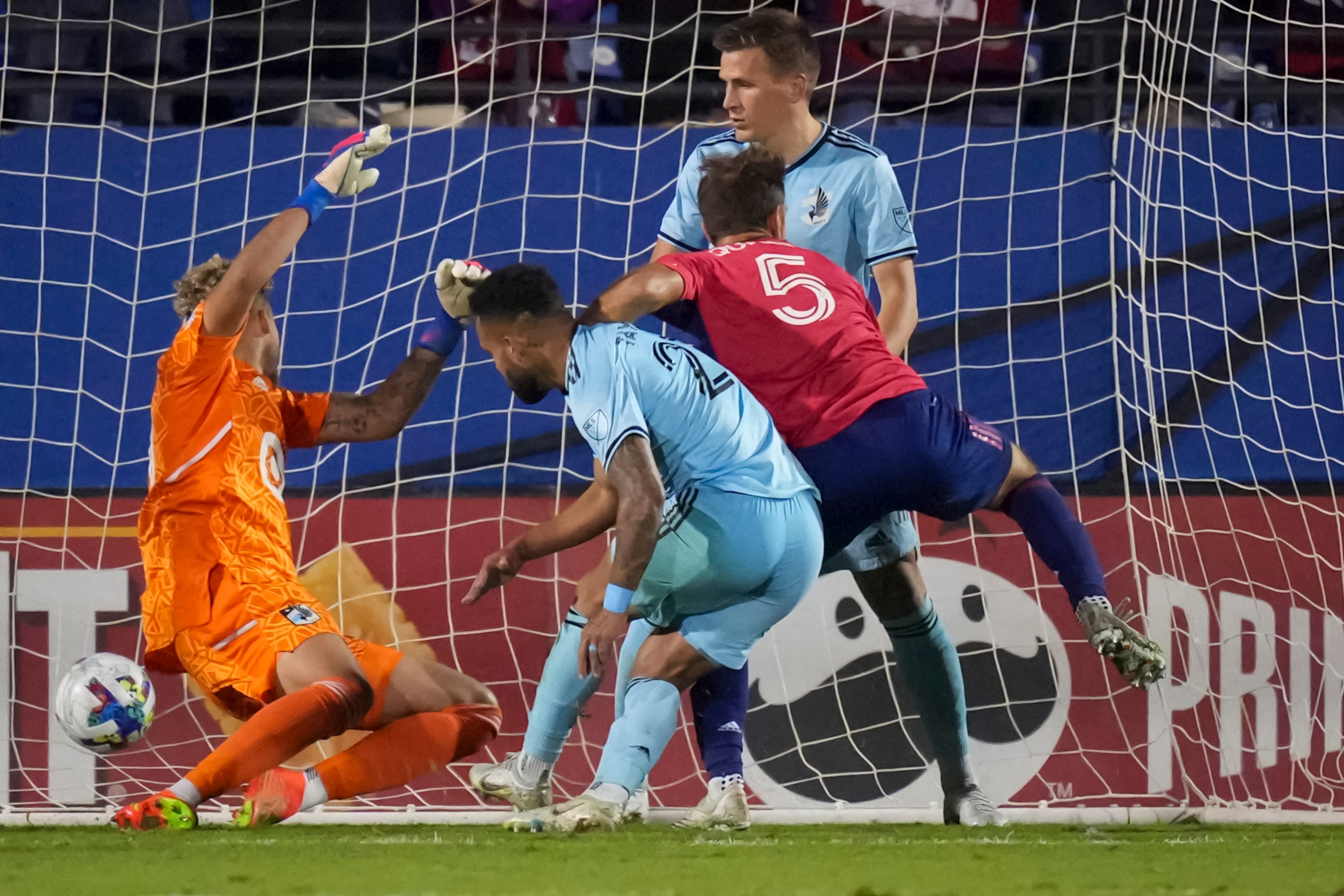 FC Dallas midfielder Facundo Quignon (5) scores the equalizer past Minnesota United...