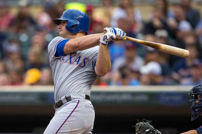May 27, 2014; Minneapolis, MN, USA; Texas Rangers catcher Chris Gimenez (60) hits a single...