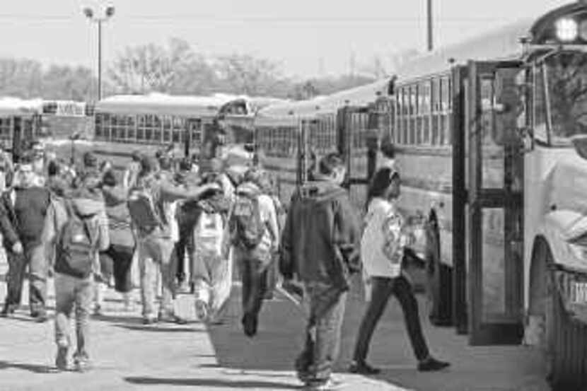 Naaman Forest High School students took buses home at the end of the school day Friday. The...