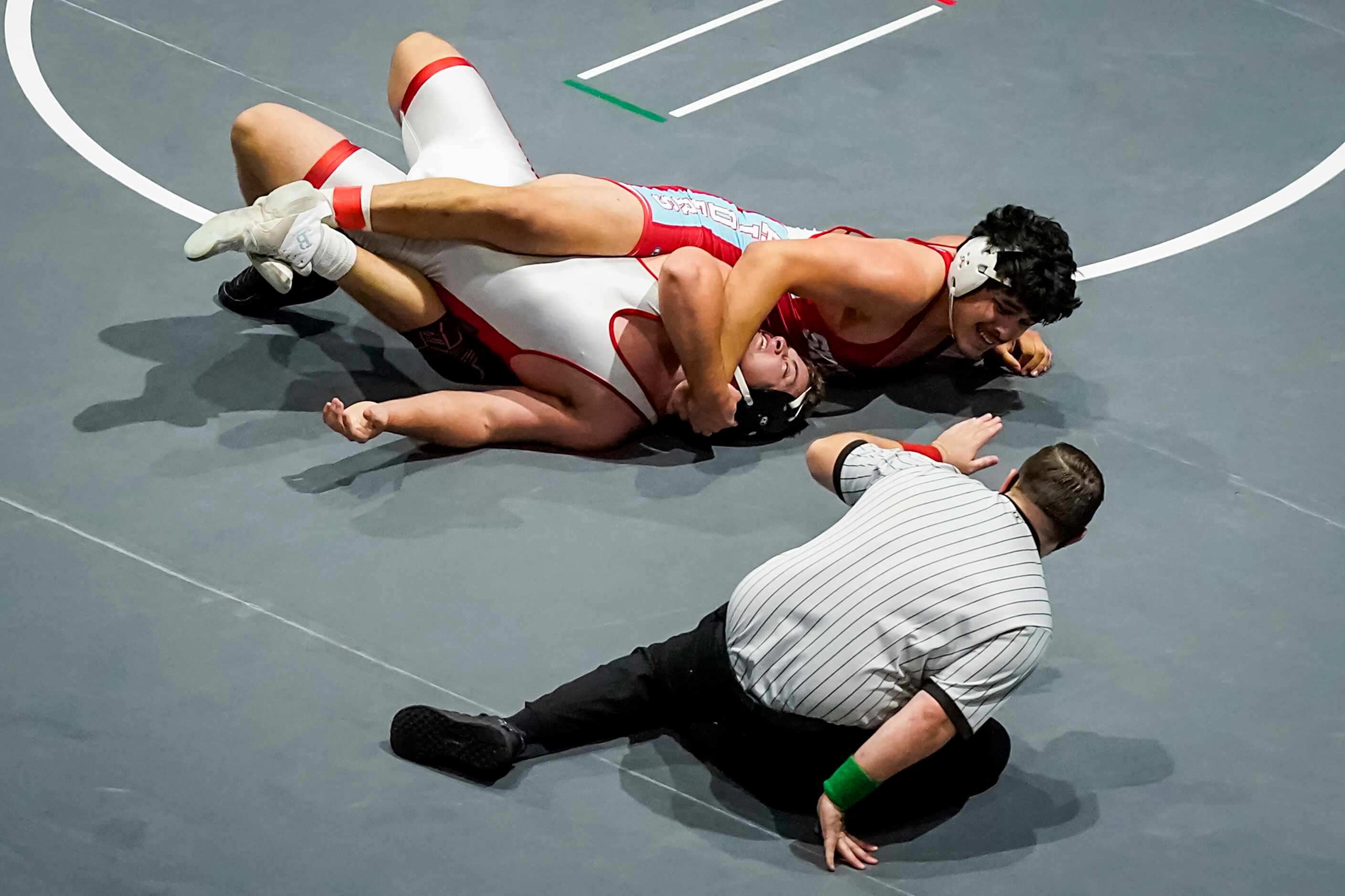 Christian Mendez of Dallas Skyline pins Isaac Slade of Austin Lake Travis in the 6A boys...