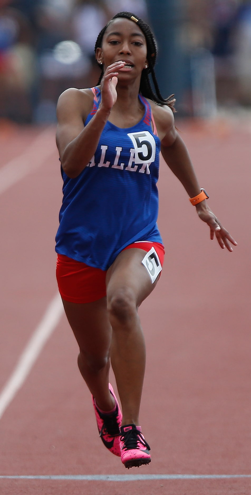 Allen High School’s Jasmin Childress competes in the 100 meters during the Jesuit-Sheaner...