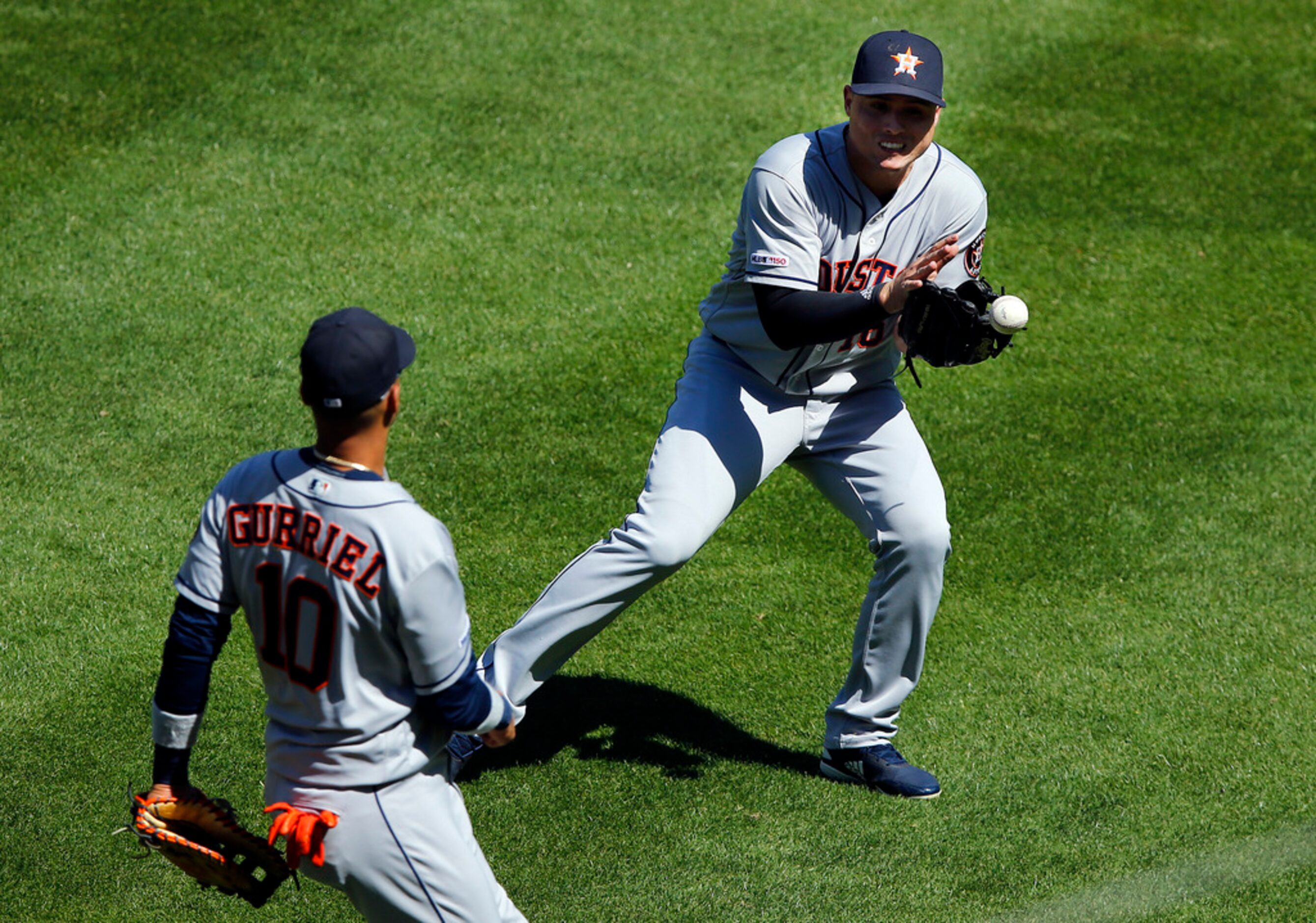 Houston Astros right fielder Josh Reddick (22) mishandles a pop fly by Texas Rangers catcher...