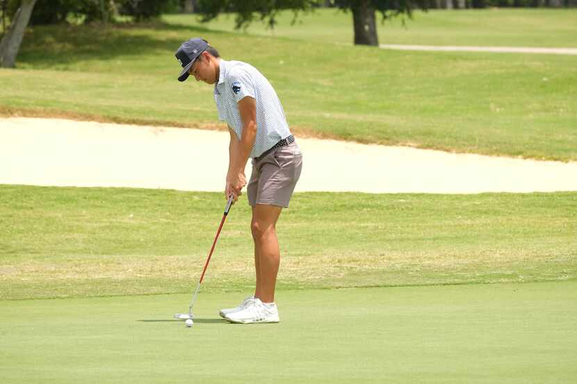 Ethan Fang of Plano West putts on his last hole during Day 2 of the UIL 6A boys golf state...