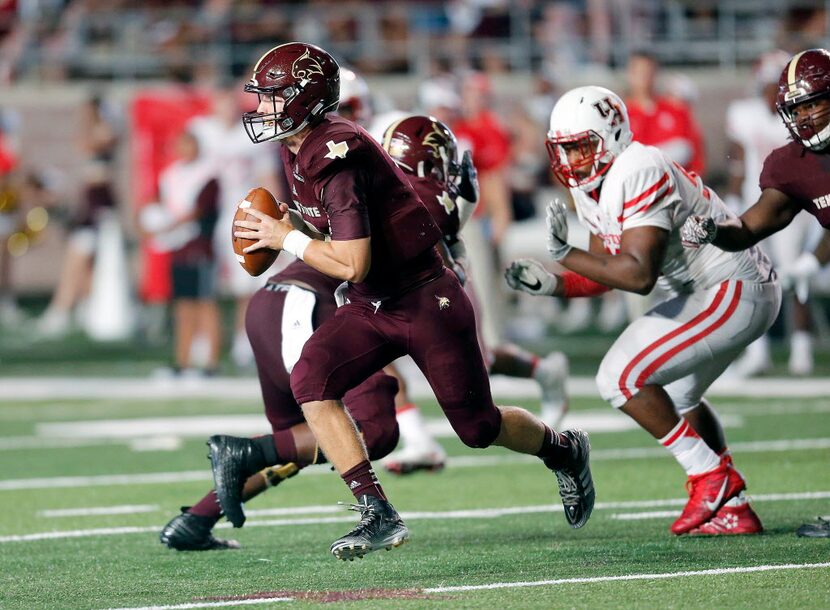 SAN MARCOS, TX - SEPTEMBER 24: Tyler Jones #2 of the Texas State Bobcats rolls out to throw...