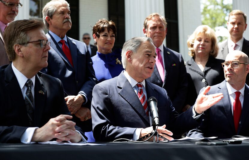 Gov. Greg Abbott (center), Lt. Gov. Dan Patrick (left), Speaker of the House Dennis Bonnen...