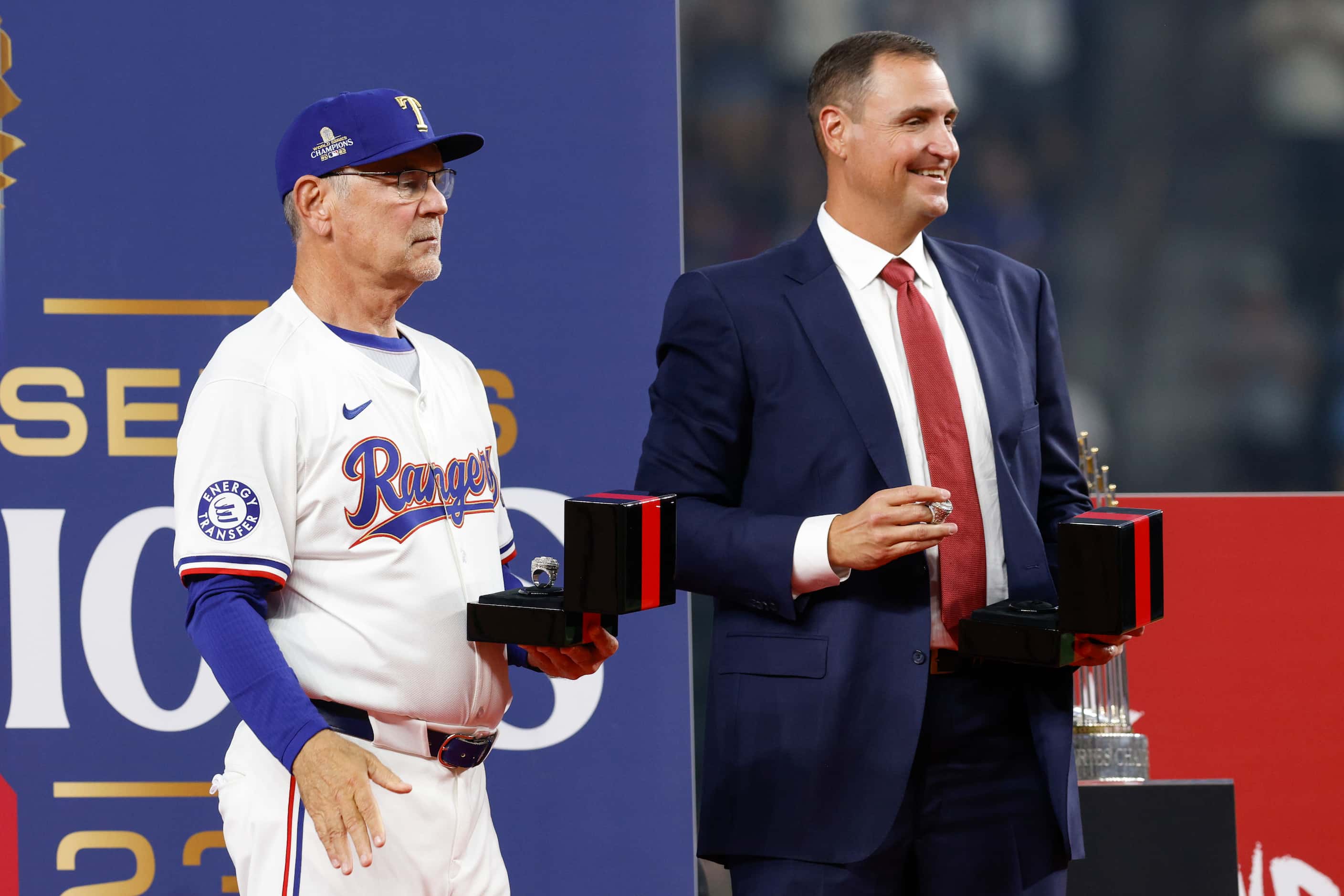Texas Rangers manager Bruce Bochy and general manager Chris Young stand on stage with the...