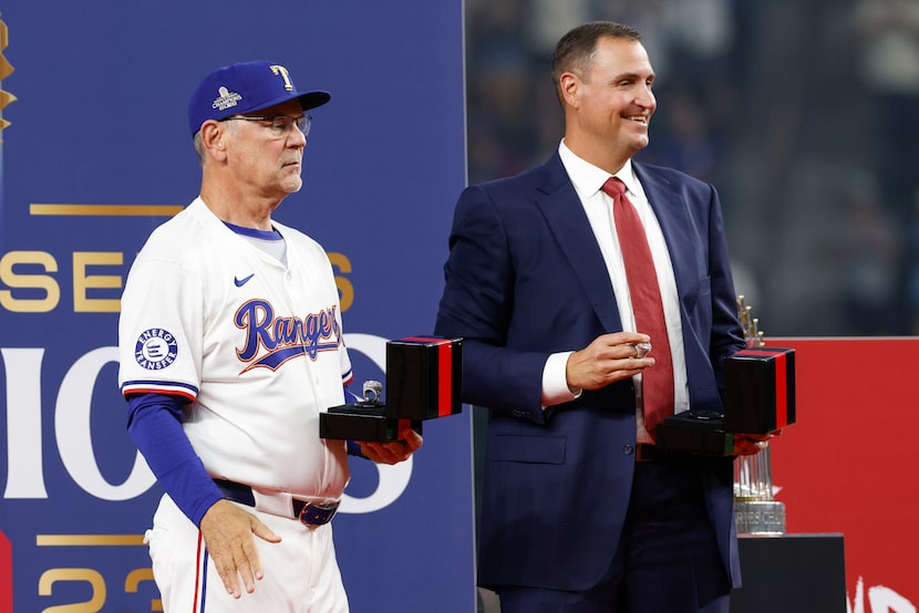 Texas Rangers manager Bruce Bochy and general manager Chris Young stand on stage with the...