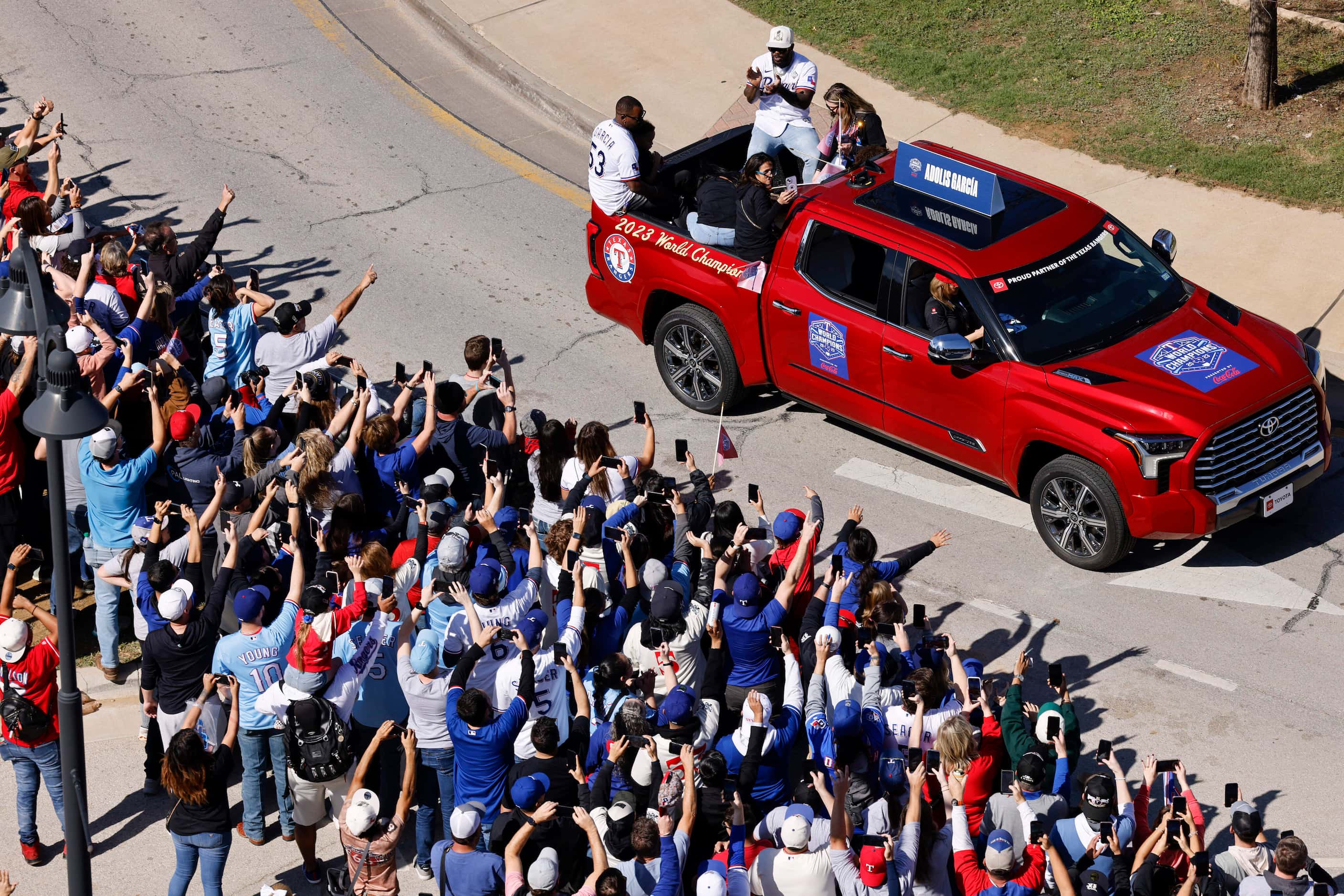 Texas Rangers right fielder Adolis Garcia claps as fans cheer during the Texas Rangers World...