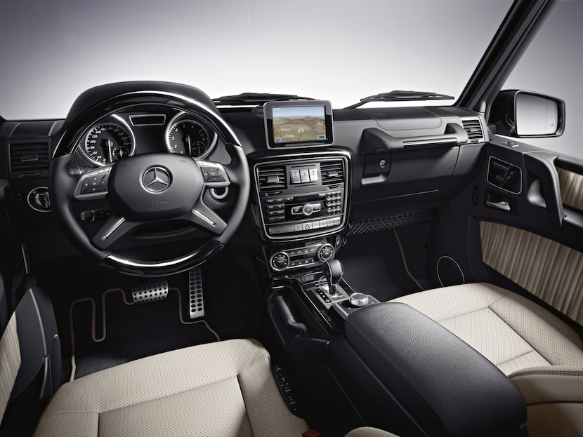 The hooded instrument panel on the 2013  G550 Mercedes-Benz houses black-faced gauges, and a...