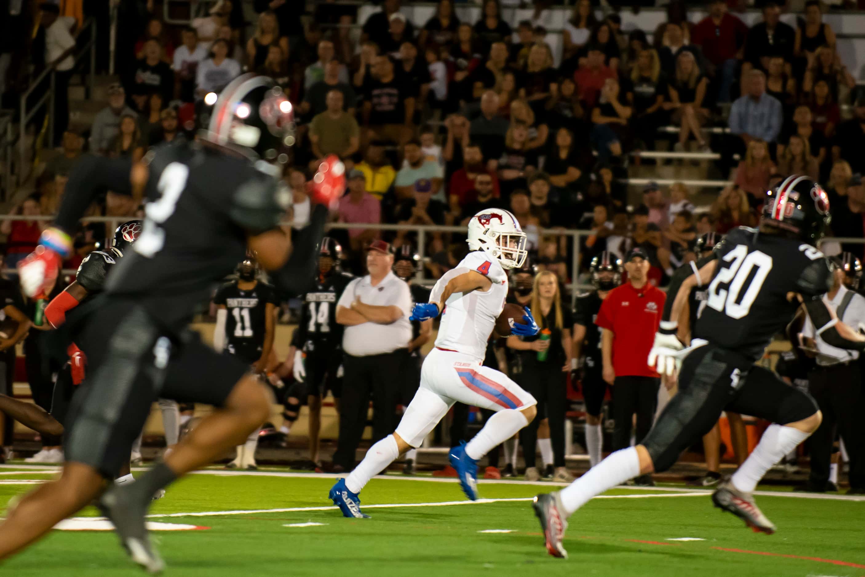 Grapevine senior Parker Polk (4) rushes down the field to score a touchdown during a...