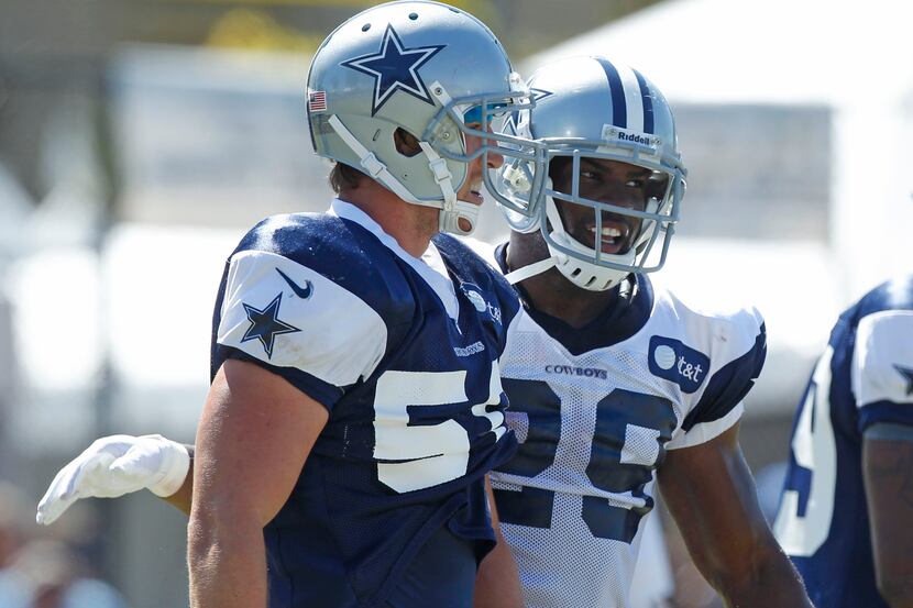 Dallas Cowboys running back DeMarco Murray (29) laughs with linebacker Sean Lee after a hard...