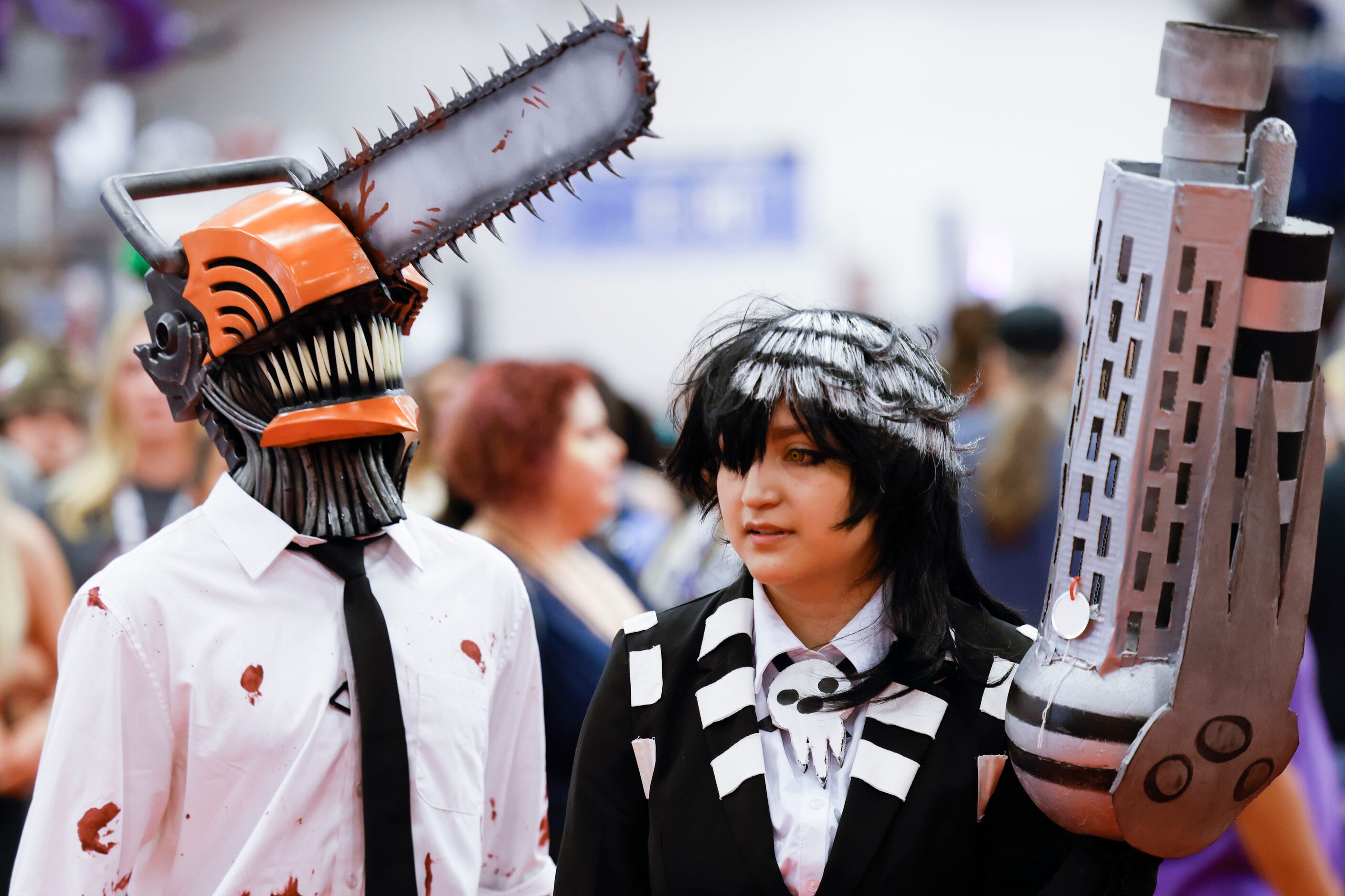 Ben Reed (left) dressed as Chainsaw Man and King Sanchez dressed as Death the Kid walks...