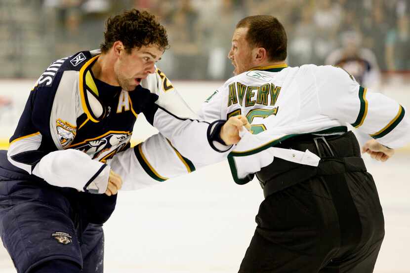  Nashville Predators defenseman Dan Hamhuis, left, fights Dallas Stars center Sean Avery,...