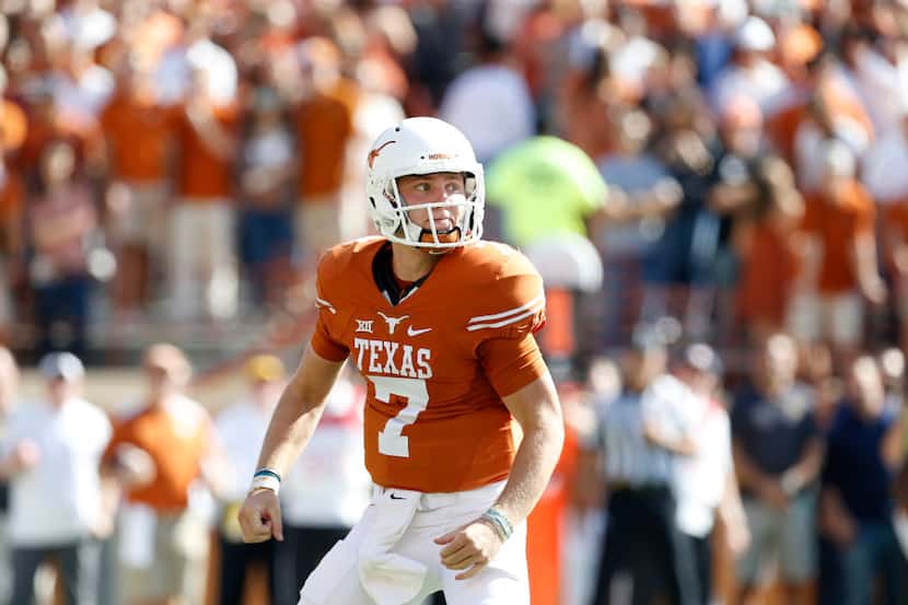 FILE - Texas quarterback Shane Buechele (7) looks to the sidelines during a game against...