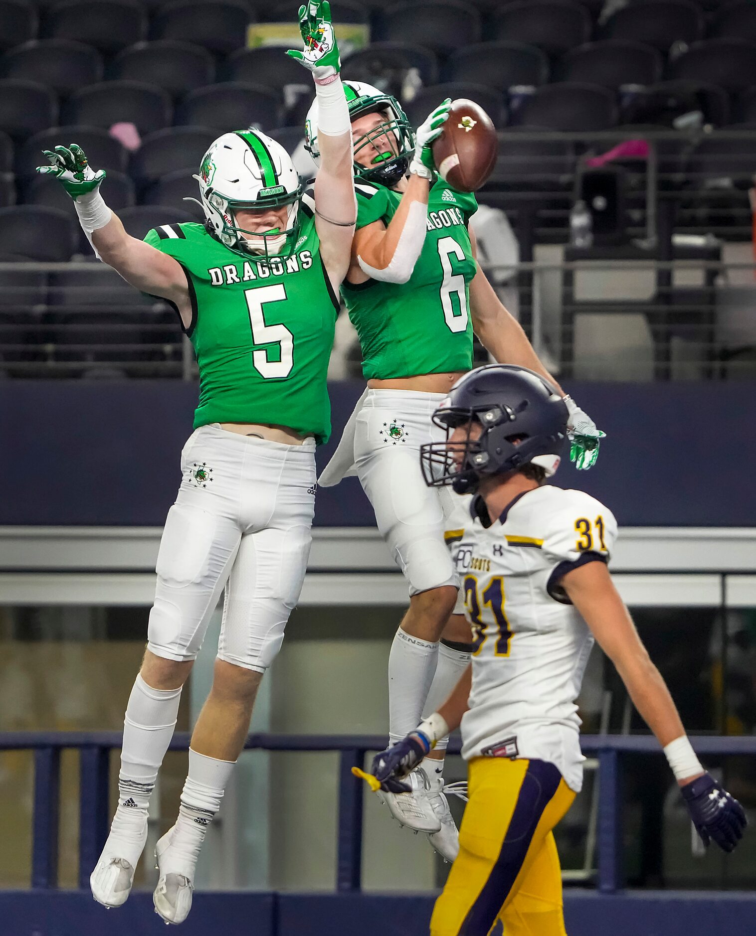 Southlake Carroll wide receiver Landon Samson (6) celebrates with Corbin Duwe (5) after...