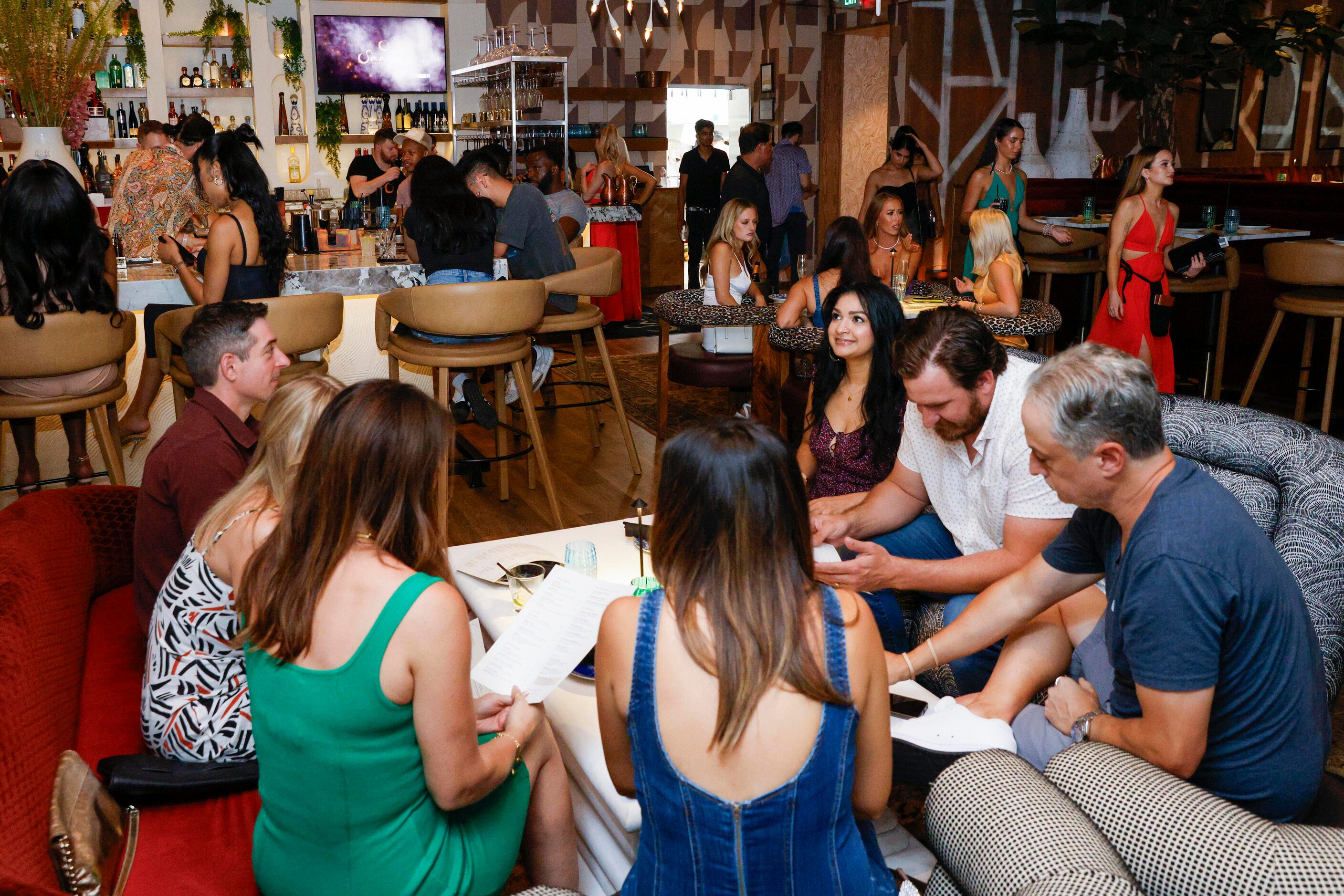 People dine at the bar and tables at Saaya in Deep Ellum, Saturday, June 17, 2023, in Dallas.