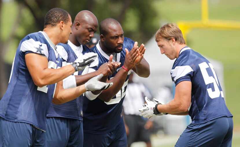 Dallas Cowboys defensive end Tyrone Crawford (70), D linebacker DeMarcus Ware (94),...