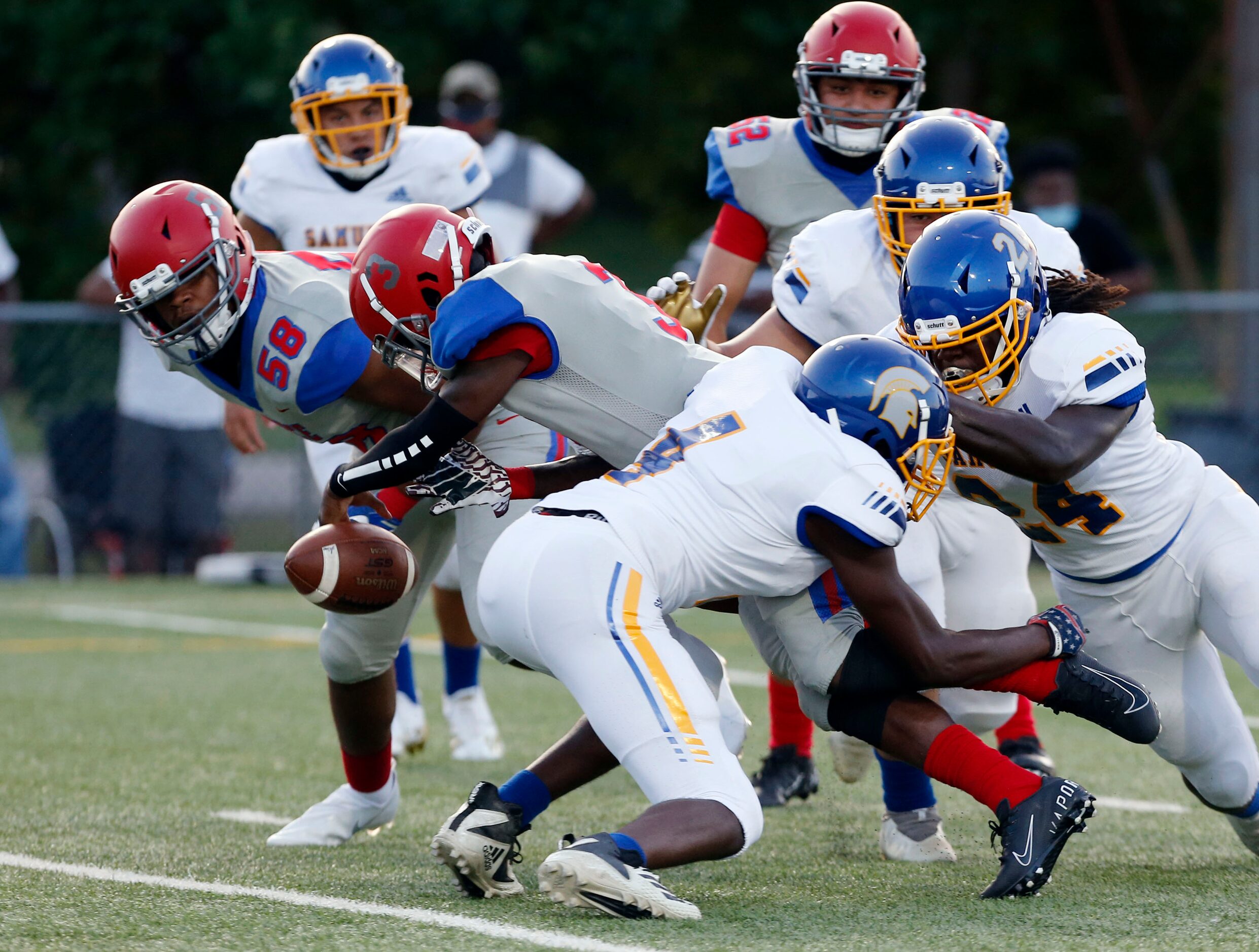 Spruce QB Timad Cotton (3) fumbles the ball at the one-yard-line and Samuell defense...