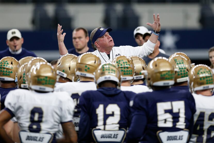 Notre Dame head coach Brian Kelly gestures as he speaks to his team during practice at AT&T...