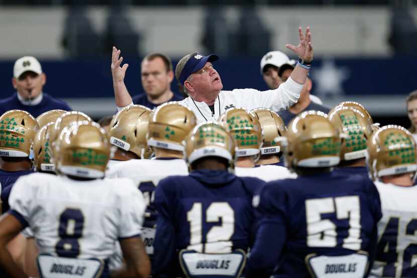 Notre Dame head coach Brian Kelly gestures as he speaks to his team during practice at AT&T...