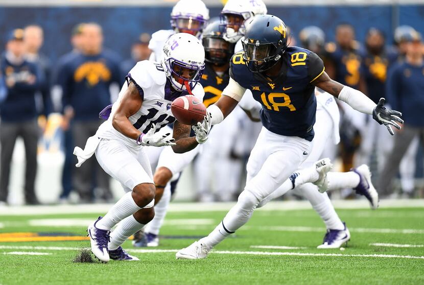 MORGANTOWN, WV - OCTOBER 22:  Desmon White #10 of the TCU Horned Frogs bobbles a kickoff in...