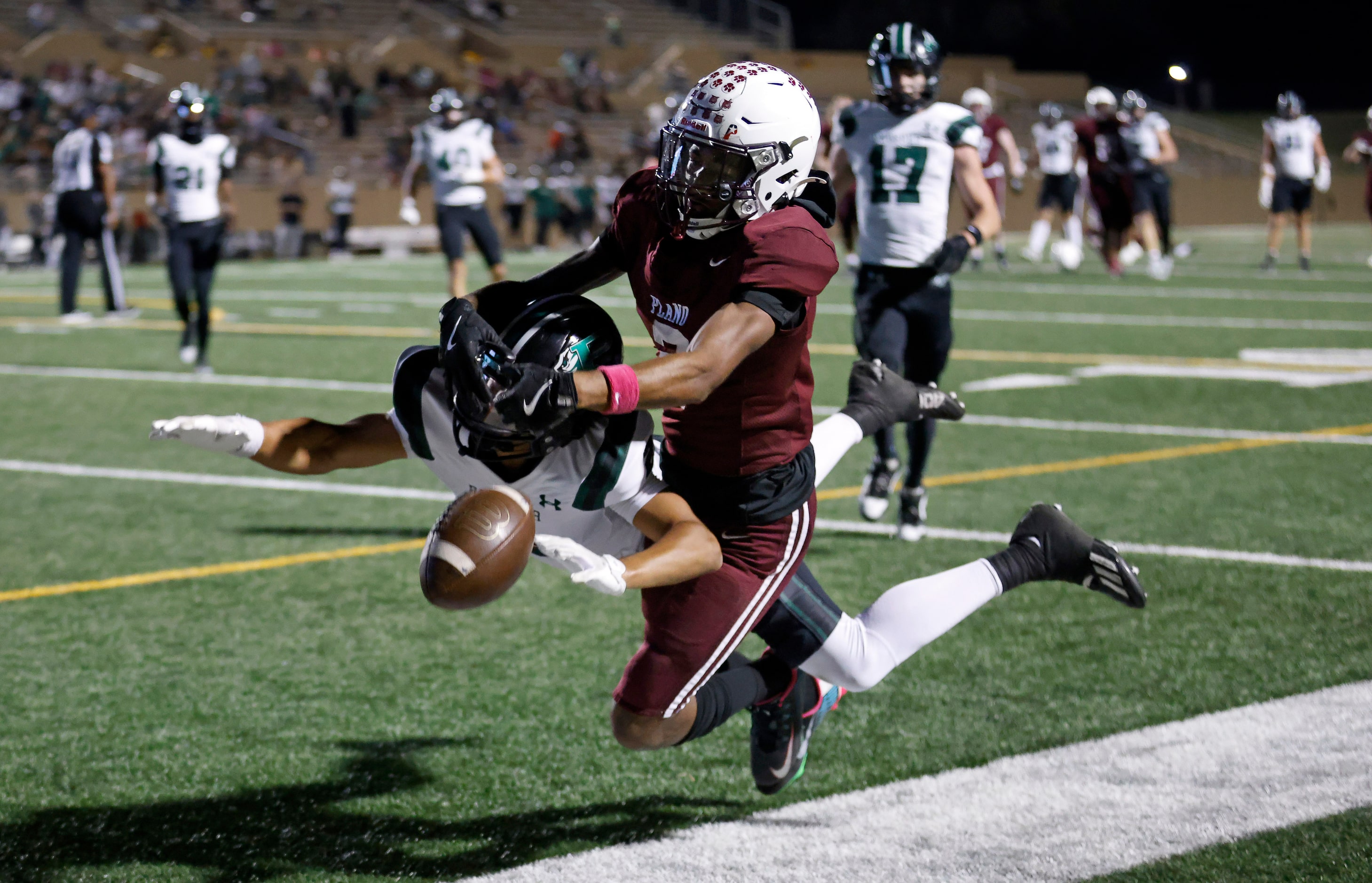 Prosper High Tyson Stiggers (2) keeps a pass in the end zone from being caught by Plano High...