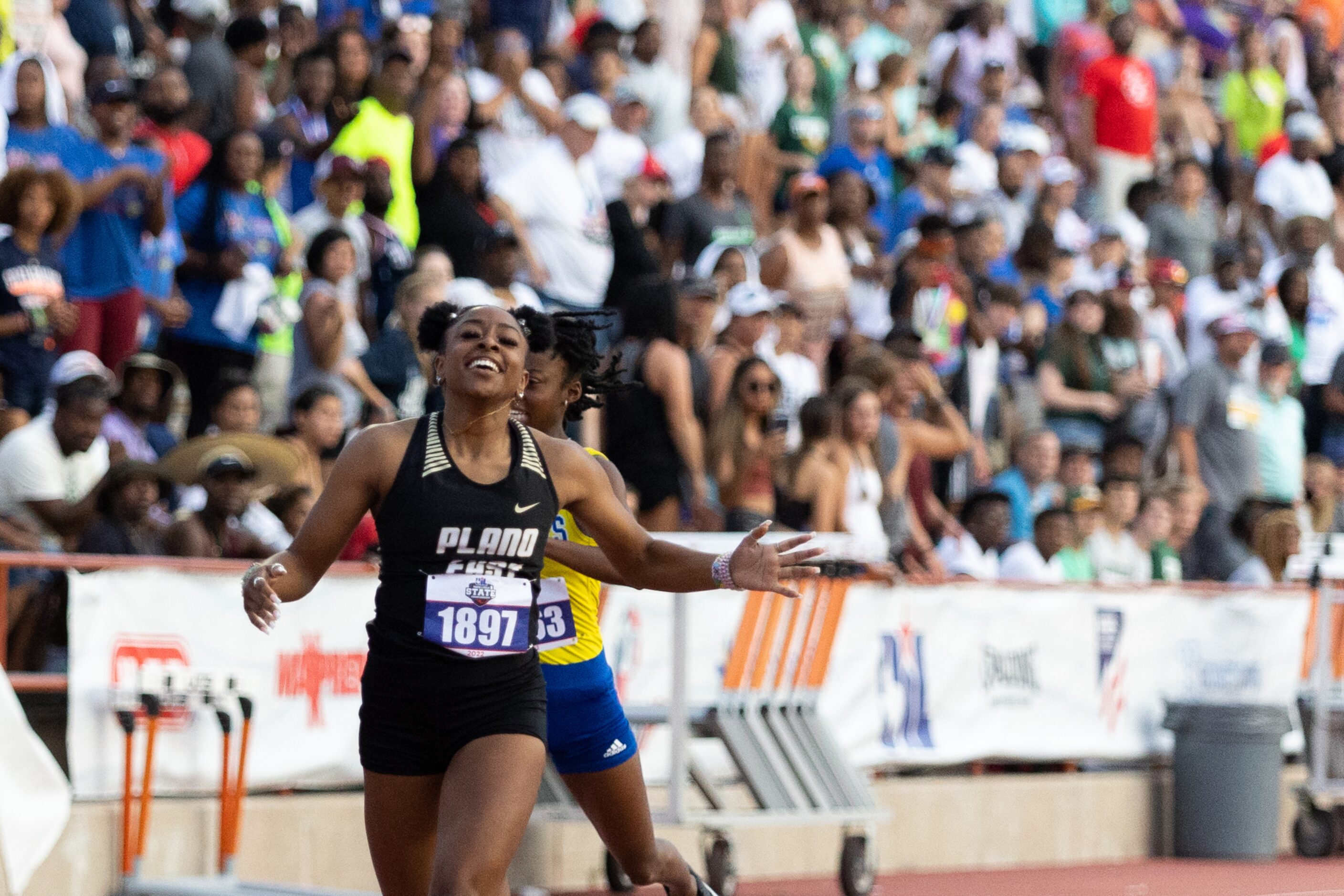 Tiriah Kelley of Plano East celebrates after winning the girls’ 200-meter dash at the UIL...