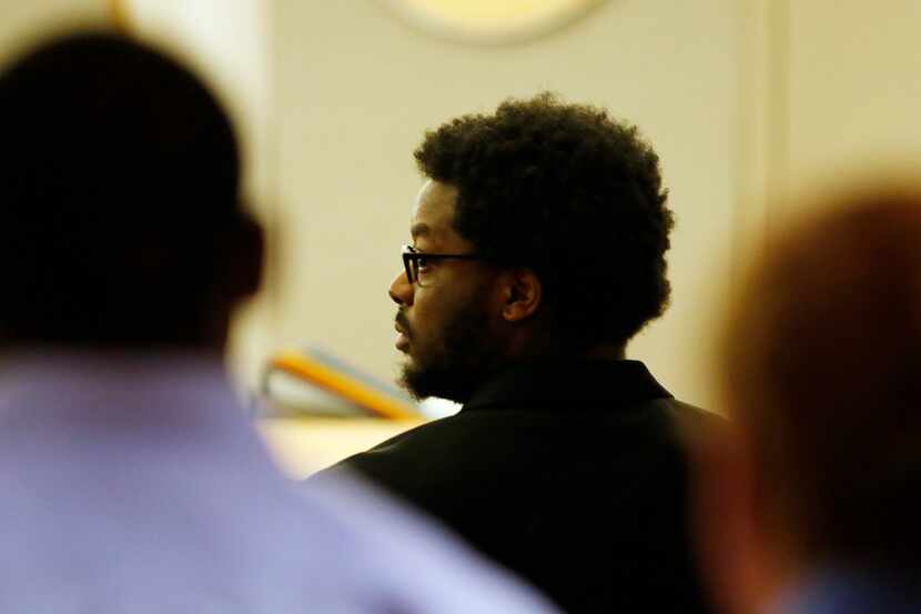 Thomas Johnson looks to his left as the jury members make their way out of the courtroom...