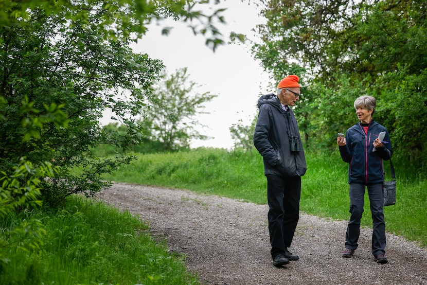  Sharon Grigsby with Father Tim Gollob on a bird watching adventure at Goat Island Preserve...