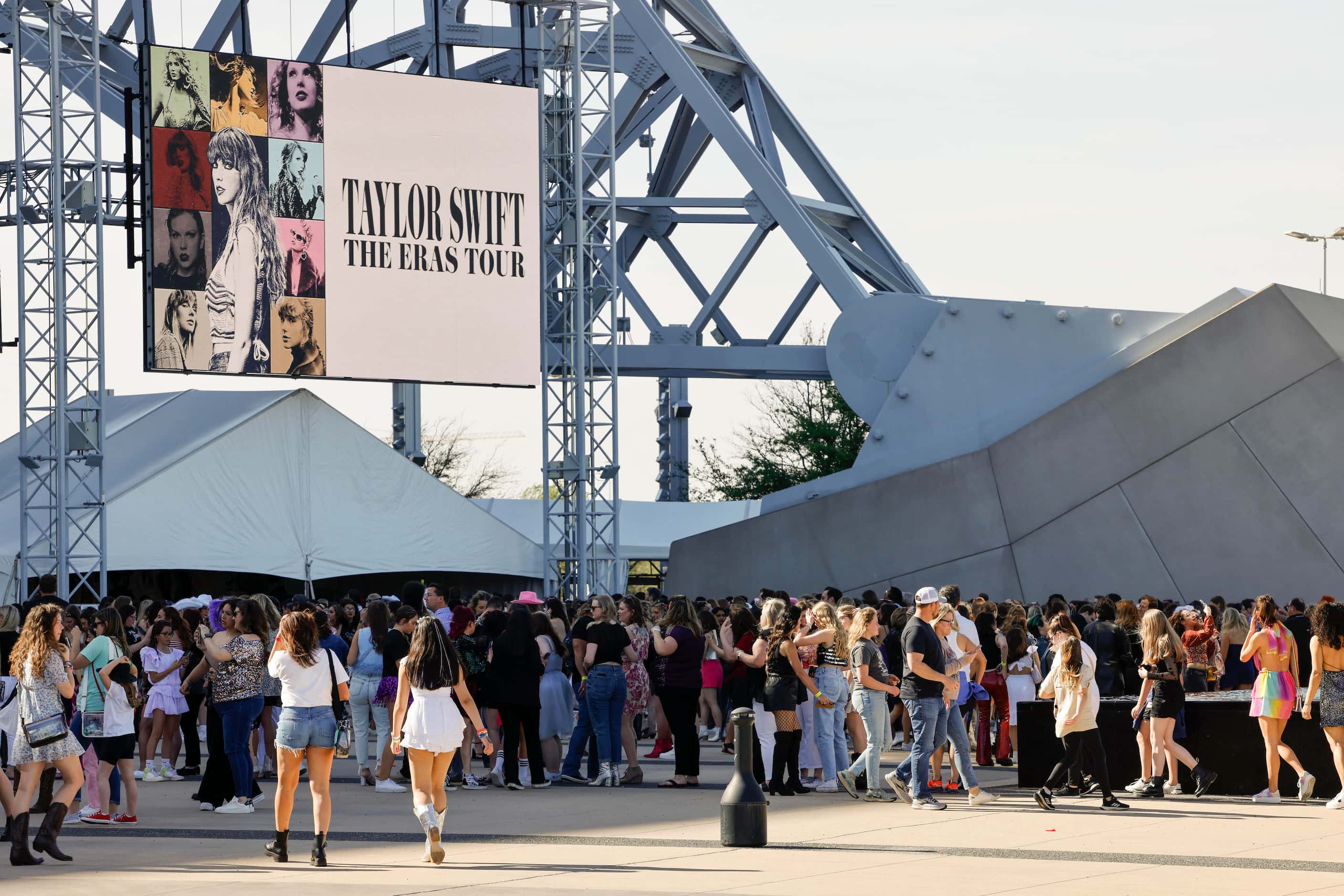 Hundreds of fans gather outside before a Taylor Swift Eras Tour concert at AT&T Stadium.