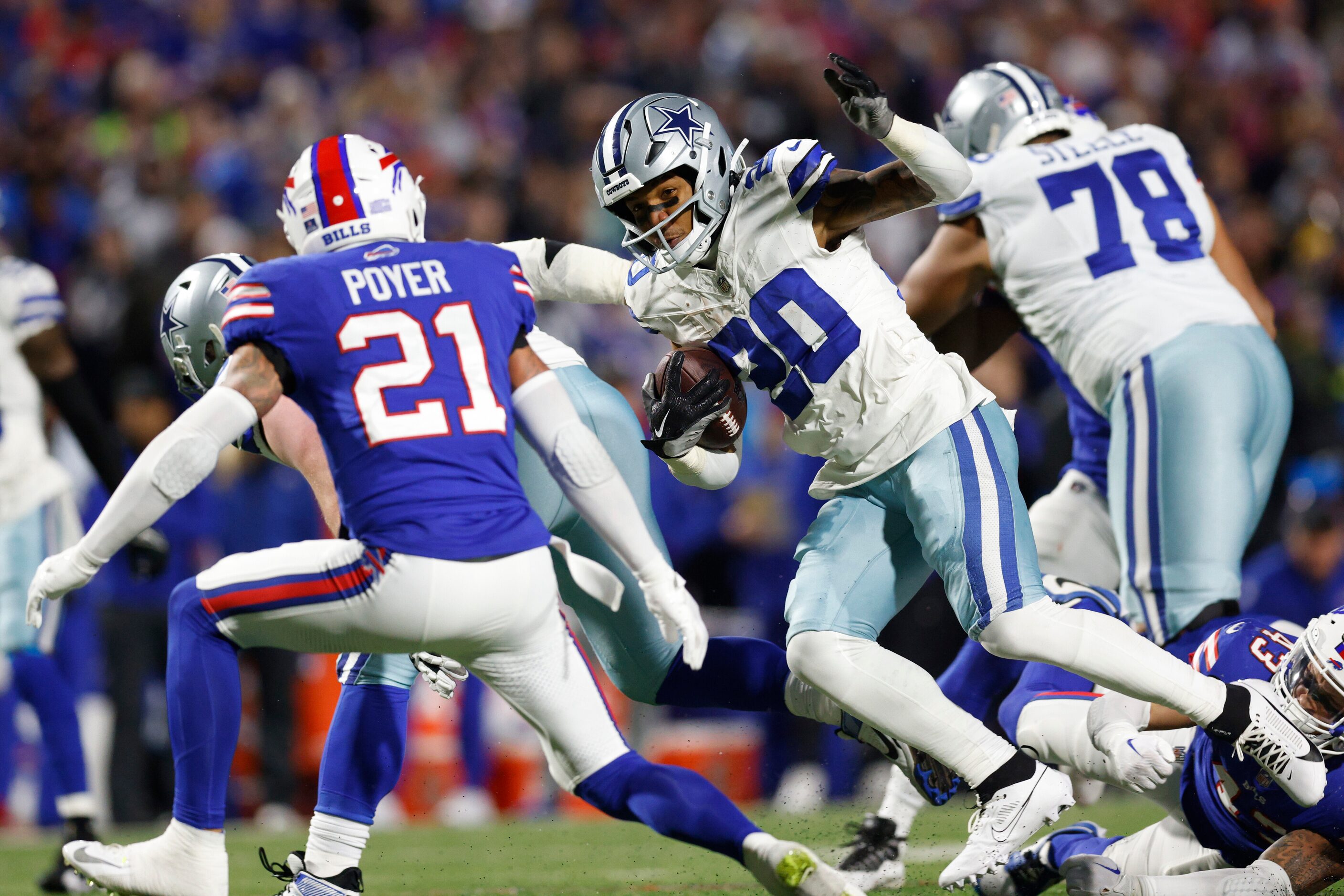 Dallas Cowboys running back Tony Pollard (20) runs the ball towards Buffalo Bills safety...