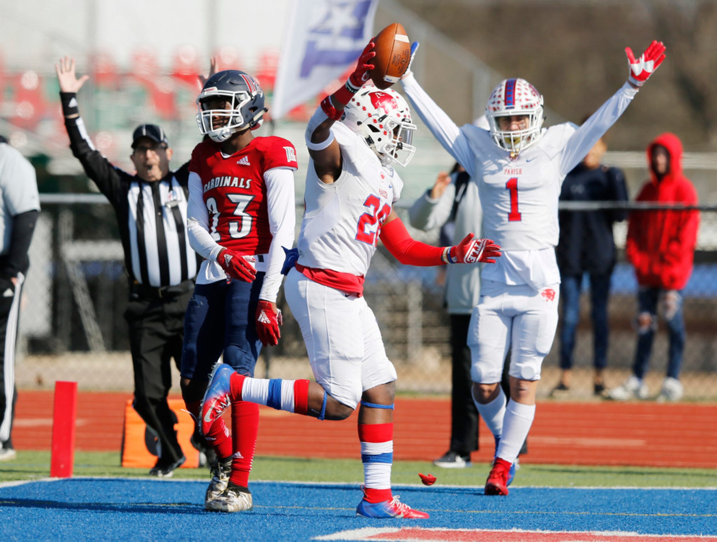 Parish Episcopal's Cauren Lynch (28) scores a touchdown as teammate Evan Greene (1)...