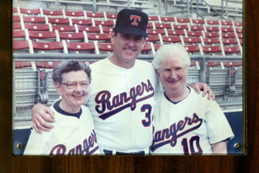 Sister Frances Evans (left) and Sister Maggie Hession posed for a photo with Nolan Ryan at...