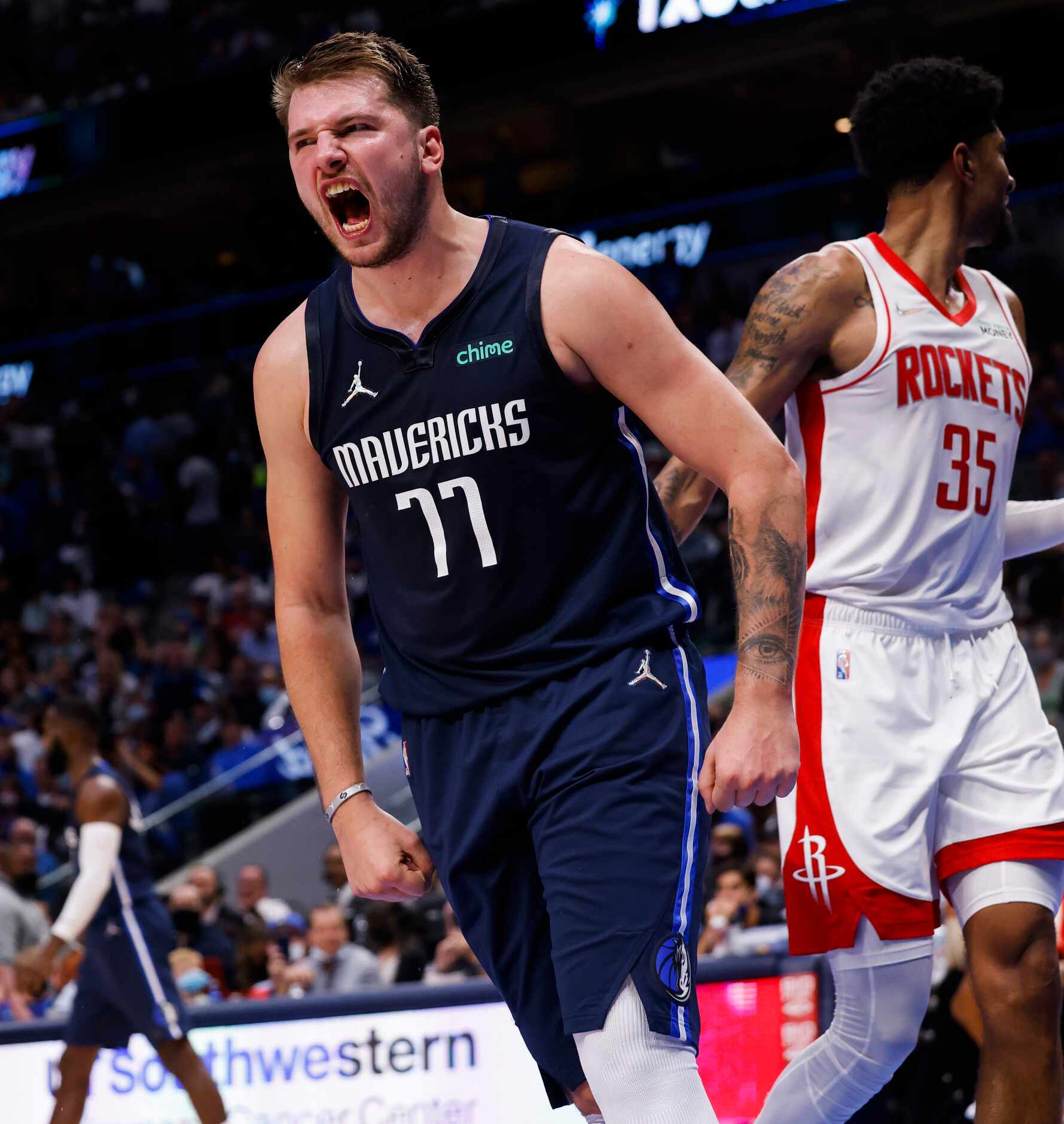 Dallas Mavericks guard Luka Dončić (77) reacts after making a basket during the fourth...