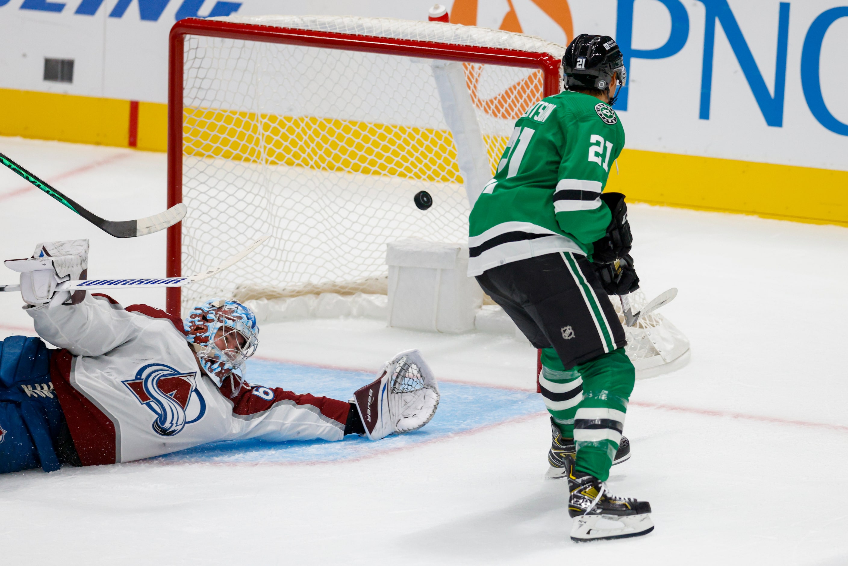 Dallas Stars left wing Jason Robertson (21) scores a goal past Colorado Avalanche goaltender...