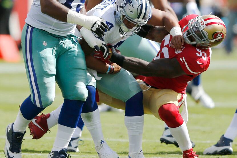 Dallas Cowboys quarterback Dak Prescott (4) is sacked by San Francisco 49ers inside...