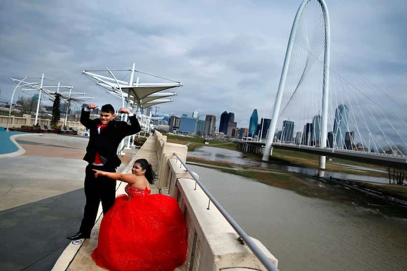 Ari Hernandez of Denton poses for quinceañera photos with her date, Neven Campos, at the...
