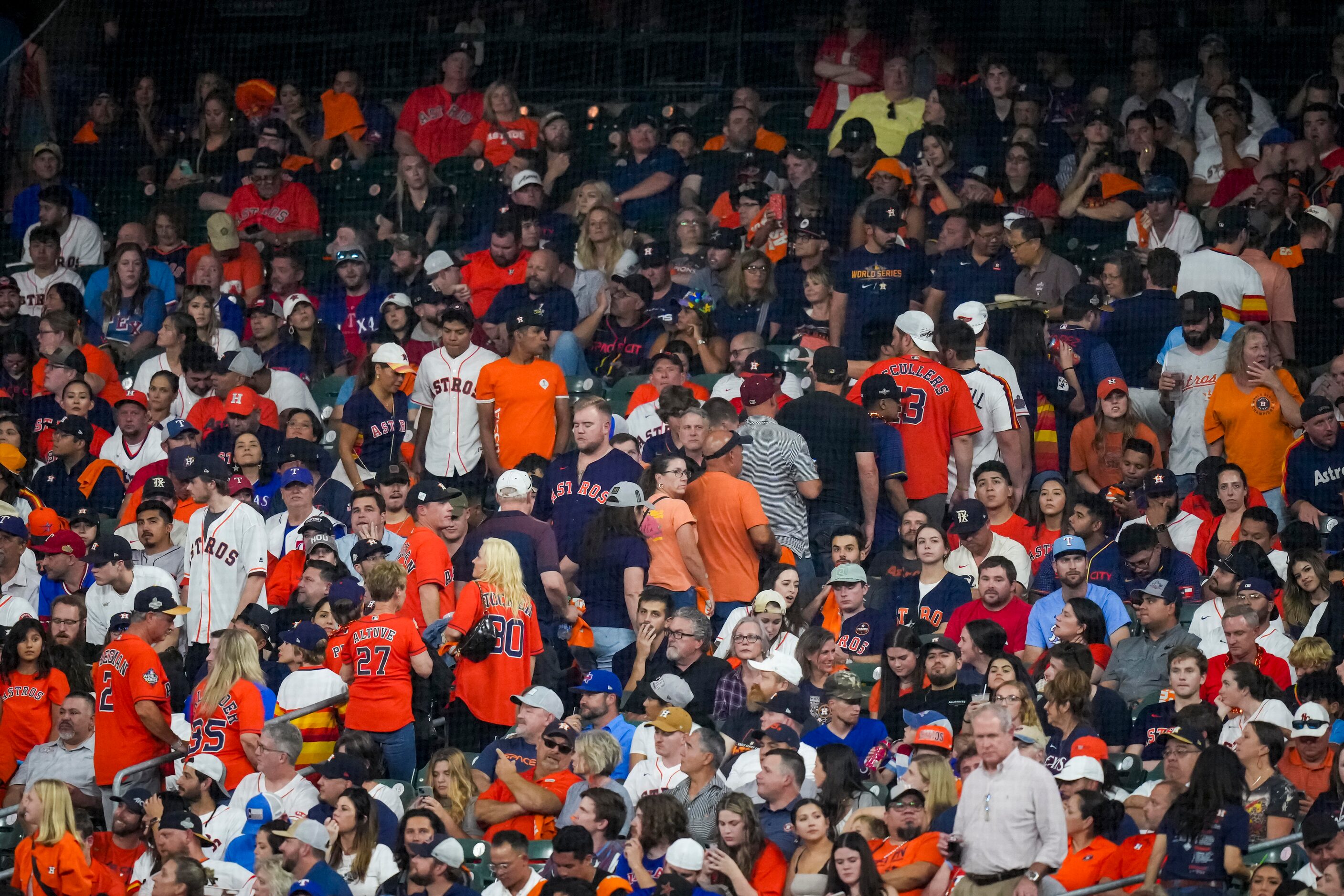 Houston Astros fans begin to leave the ballpark after the end of the sixth inning against...