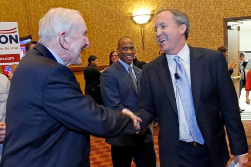 
Ken Paxton (right), with U.S. Rep. Sam Johnson, has said through a spokesman that he would...