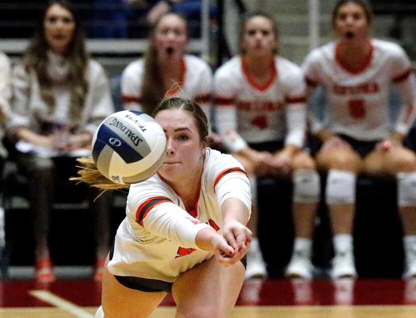 Celina High School setter Megan Hodges (9) tries to save the ball during game two as Celina...