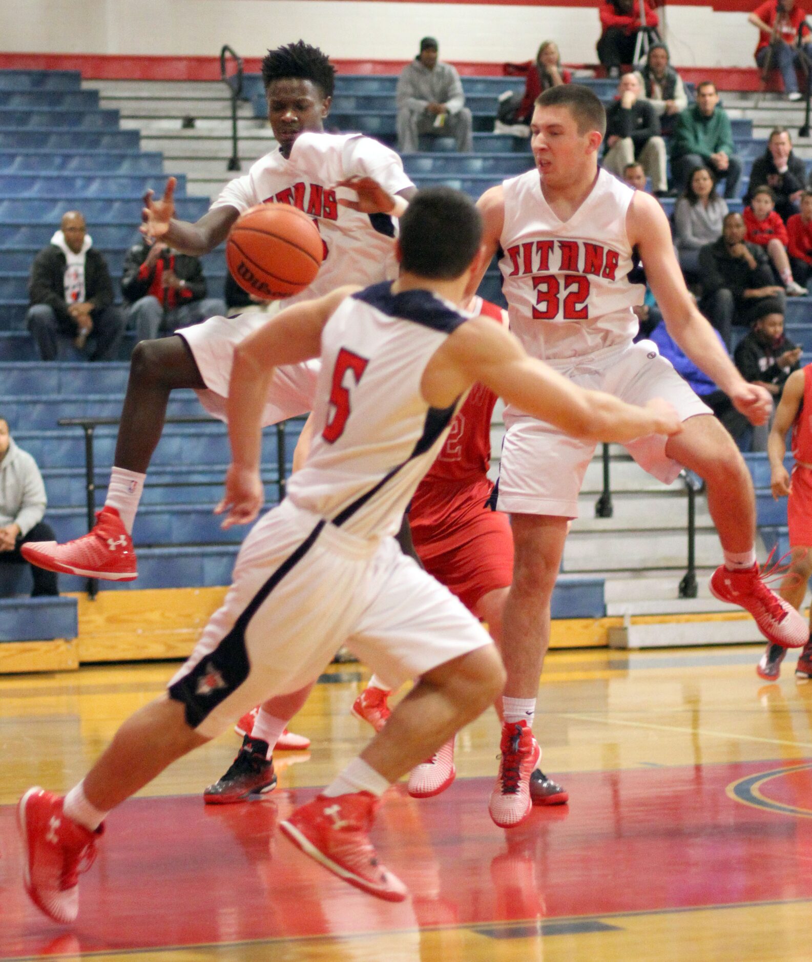 Frisco Centennial forward Jonathyn Washington (25) goes up for an offensive rebound as he is...