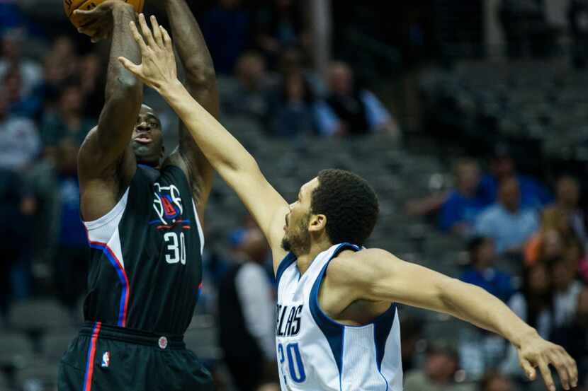 Dallas Mavericks center A.J. Hammons (20) tries to block a shot by LA Clippers forward...
