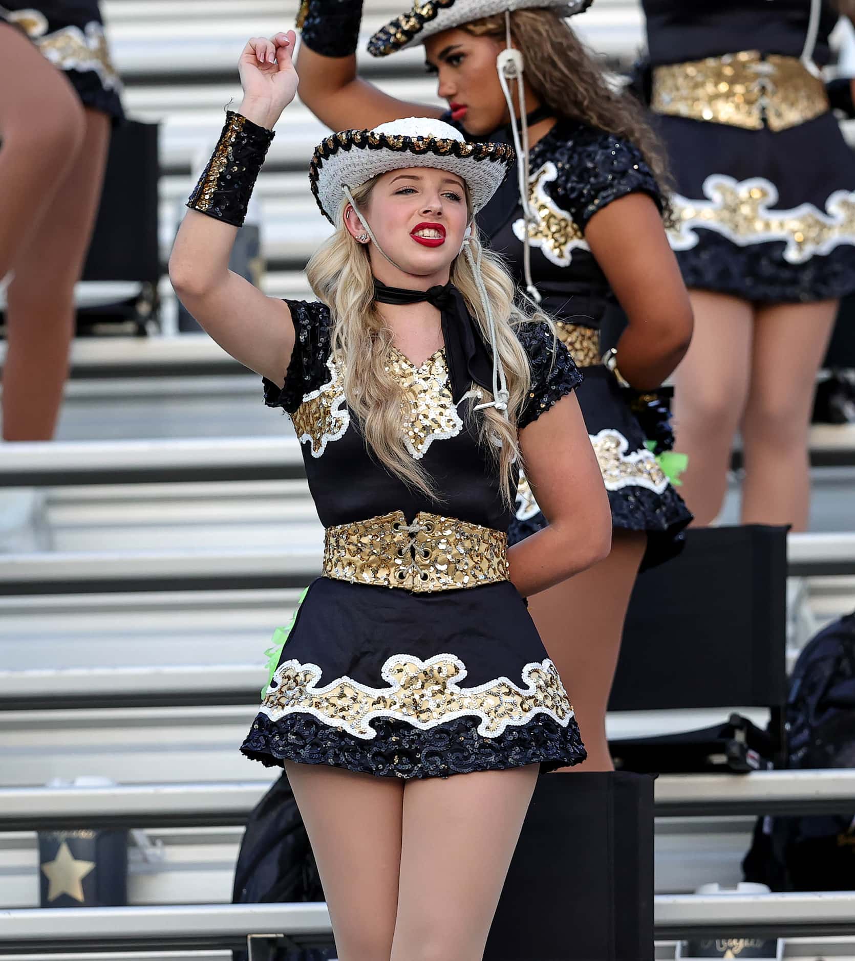 The Mansfield drill team perform before their game against Cedar Hill in a District 11-6A...