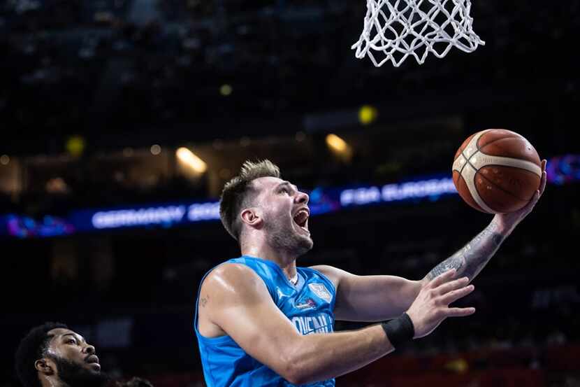 Luka Doncic scores during Slovenia's win over Hungary in the EuroBasket group stage Sept. 3,...