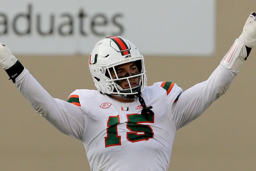 Jaelan Phillips of Miami celebrates a defensive stop during the second half of an NCAA...